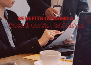 Two people looking at the paper, benefits of using a workforce provider-featured image