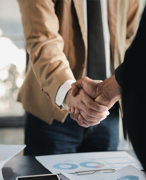 Two businessmen of a manpower employment agency shaking hands