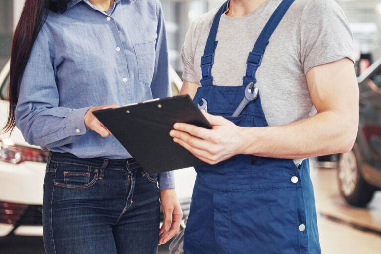 Mechanic collaborating with their supervisor in the automotive repair industry