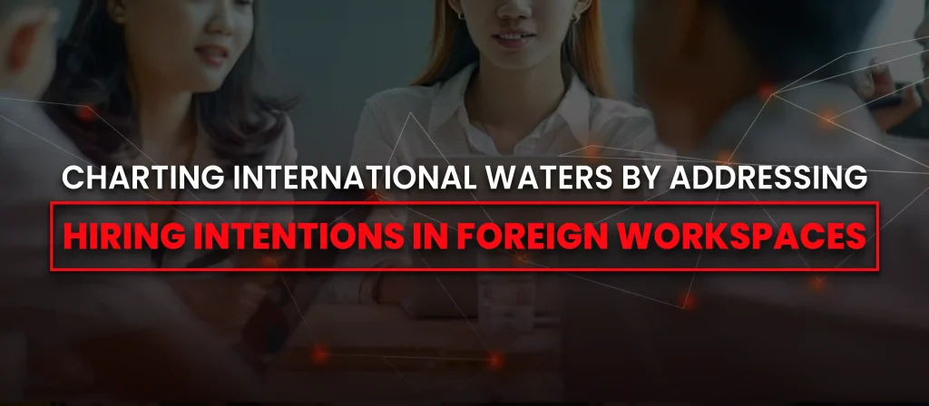 A business team discussing hiring strategies—addressing recruitment intentions in international work environments.
